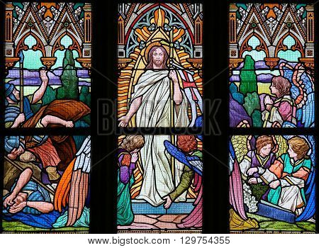 PRAGUE CZECH REPUBLIC - APRIL 5 2016: Stained Glass in the Basilica of Vysehrad in Prague Czech Republic depicting Jesus rising from the grave