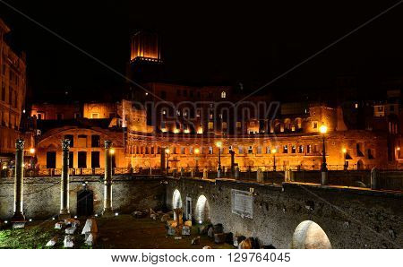 View of the Trajan's Forum at night with Basilica Ulpia columns and Tower of the Militia