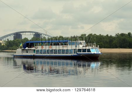KIEV,UKRAINE - MAY 15, 2016: Pleasure boats on the Dnepr River and river shore in historical area. Kiev. Ukraine