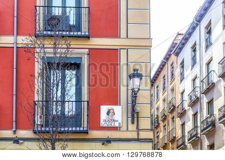 Madrid Spain cityscape. Street sigh in Square Isabel II (Plaza de Isabel II) in Madrid Spain.