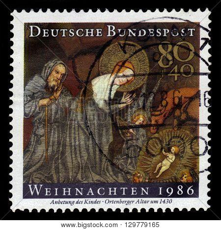 GERMANY - CIRCA 1986: a stamp printed in Germany shows adoration of the Child, left wing of Ortenberger altar by anonymous german painter, circa 1986
