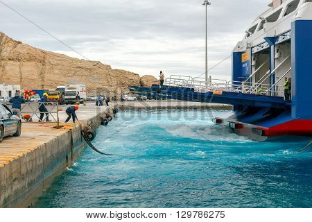 Santorini, Greece - May 2, 2016: The big sea ferry is moored off in the port of Athinios on the island of Santorini. Sea ferries make regular flights between the Greek islands.