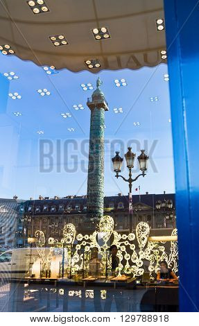 Paris France - September 29 2011: Reflection of the column on a shopwindow in Place Vendome.