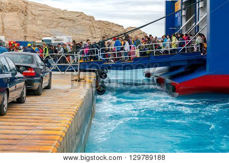 Santorini, Greece - May 2, 2016: The big sea ferry is moored off in the port of Athinios on the island of Santorini. Sea ferries make regular flights between the Greek islands.