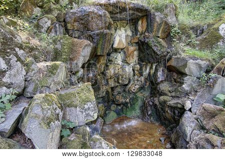 Detail of the mineral water spring - ferruginous water