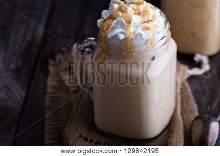 Iced coffee with caramel syrup and whipped cream