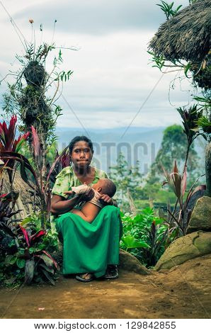 Sitting Woman With Child