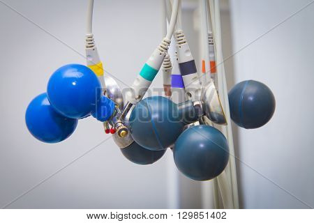 Blue ECG suckers hanging. ECG Medical accesssories
