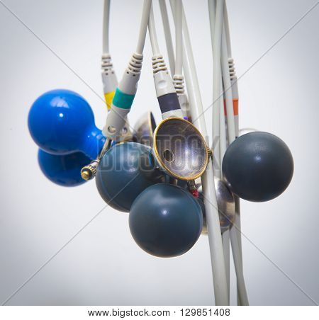 Blue ECG suckers hanging. ECG Medical accesssories