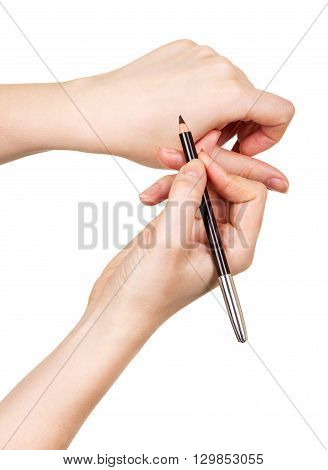 The black eyebrow pencil in the hands of women isolated on white background.