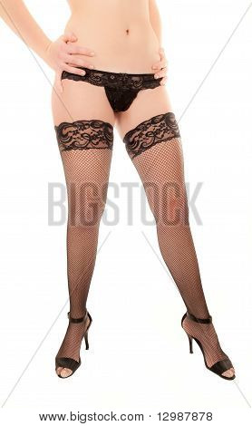 Siyah çorap ve yüksek topuklu seksi bir kadın bacakları