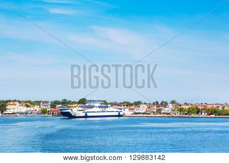 Keramoti, Greece - May 1, 2016: Keramoti port and town view with ferry boat going to Thassos island