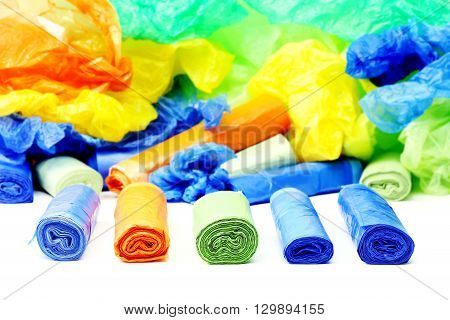 A lot of a colorful garbage bags rolls