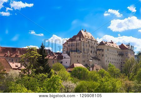 Old castle with blue background and green vegetaion