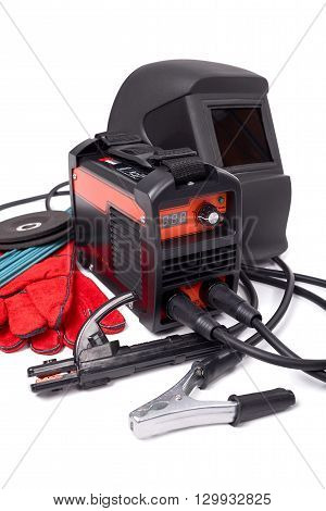 Inverter welding machine, welding equipment, isolated on a white background, welding mask, leather gloves, welding electrodes, high-voltage wires with clips, set of accessories for arc welding.