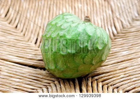 fresh green fruit cherimoya on Woven background