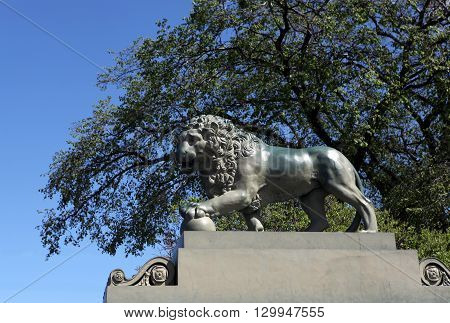 Monument - Lion with a ball in the Palace Bridge in St Petersburg. One of the symbols of St. Petersburg. St. Petersburg. Russia.