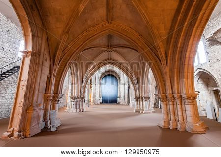 Santarem, Portugal. September 11, 2015: View under the High-Choir porch in the Church of the Sao Francisco Convent. 13th century Mendicant Gothic Architecture. Franciscan Religious Order.