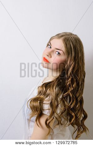 emotionless young woman posing on a white background