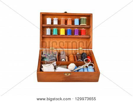 Sewing kit in wooden box isolated on white background