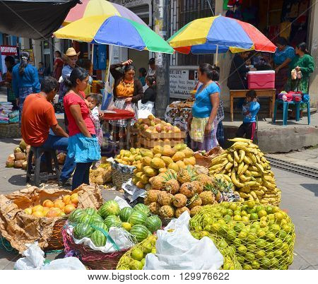 QUETZALTENANGO GUATEMALA april 28 2016 : People sale fruits in Quetzaltenango maket. This native market is the most colorful in Central America