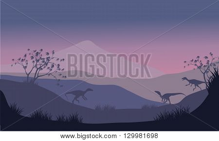 Silhouette of eoraptor in hills at the morning