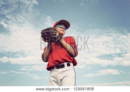 Boy pitching a baseball
