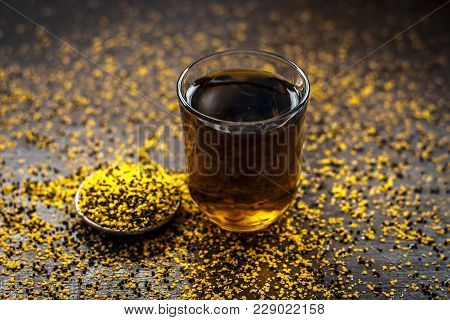 Close Up Of  Extracted Water Of Lal Sarson/brown Mustard  Seeds In A Transparent Glass With Crushed 