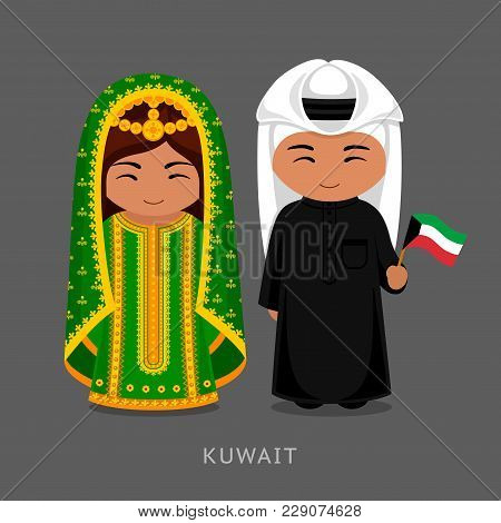 Kuwaitis In National Dress With A Flag. Man And Woman In Traditional Costume. Travel To Kuwait. Peop