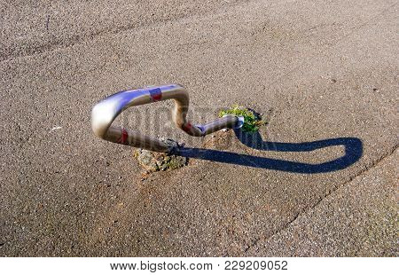 Metal Roadblock Completely Crashed And Crooked In The Street