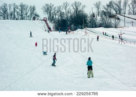 Poltava, Ukraine - March 02, 2018: People Descend On The Ski Slope Near Poltava