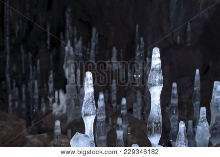 Ice Formations In A Dark Underground Cave