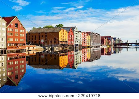 Colorful Old Houses At The Nidelva River Embankment In The Center Of Trondheim Old Town, Norway
