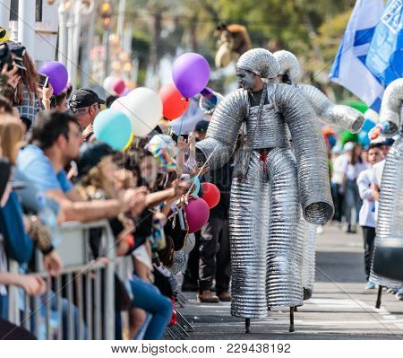 Nahariyya, Israel, March 02, 2018 : Participants Of The Annual Carnival Of Adloyada Walking On Stilt