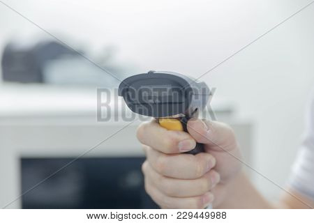 Close Up Of Hand With Bar Code Scanner
