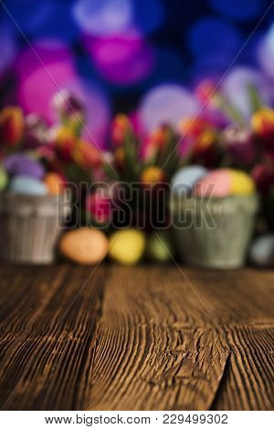 Easter Theme. Easter Eggs. Colorful Tulips. Rustic Wooden Table. Shallow Depth Of Focus. Bokeh Backg