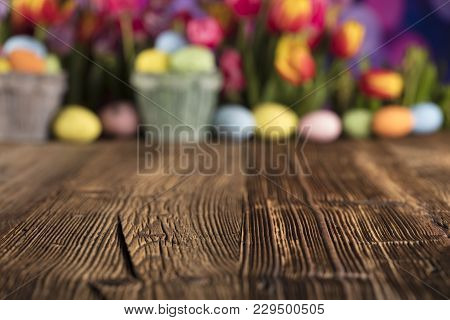 Easter Theme. Easter Eggs. Colorful Tulips. Rustic Wooden Table. Shallow Depth Of Focus. Bokeh Backg
