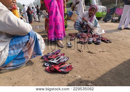 Seller Selling Shoes To Sari Clad Indian Women, Kolkata, India