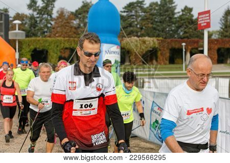 WROCLAW, POLAND - OCTOBER 15, 2017: People in fitness course nordic walking competition in the city park