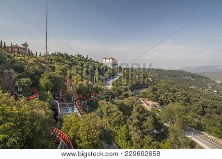 Barcelona,spain-june 11,2013: Tibidabo Amusement Park And Mountain View, Parc Atraccions, Build In 1