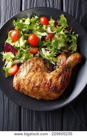 Grilled Chicken Leg With Fresh Vegetable Salad Close-up. Vertical Top View