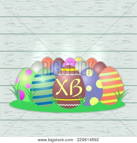 Set Of Multi-colored Easter Eggs, Central With The Letters Xb, On A Wood Texture Background. Congrat