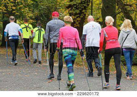 WROCLAW, POLAND - OCTOBER 15, 2017: People in fitness course nordic walking competition in the city park
