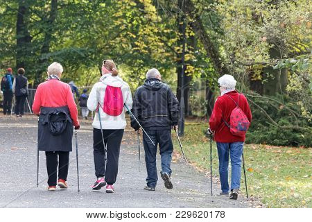 WROCLAW, POLAND - OCTOBER 15, 2017: People in fitness course nordic walking competition in the city park