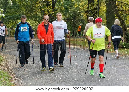 WROCLAW, POLAND - OCTOBER 15, 2017: People in fitness course nordic walking competition in the city park
