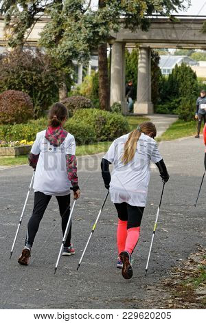WROCLAW, POLAND - OCTOBER 15, 2017: People in fitness course nordic walking competition in the city park
