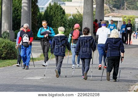 WROCLAW, POLAND - OCTOBER 15, 2017: People in fitness course nordic walking competition in the city park
