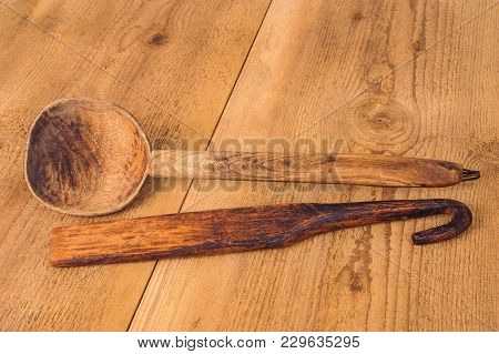 Old Kitchen Utensils On A Wooden Table