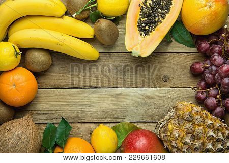 Frame With Copy Space From Fresh Tropical And Summer Seasonal Fruits Pineapple Papaya Mango Coconut 