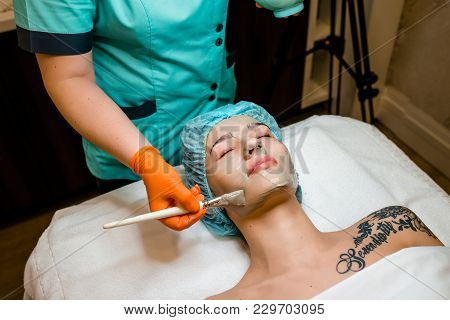Face Peeling Mask, Spa Beauty Treatment, Skincare. Woman Getting Facial Care..